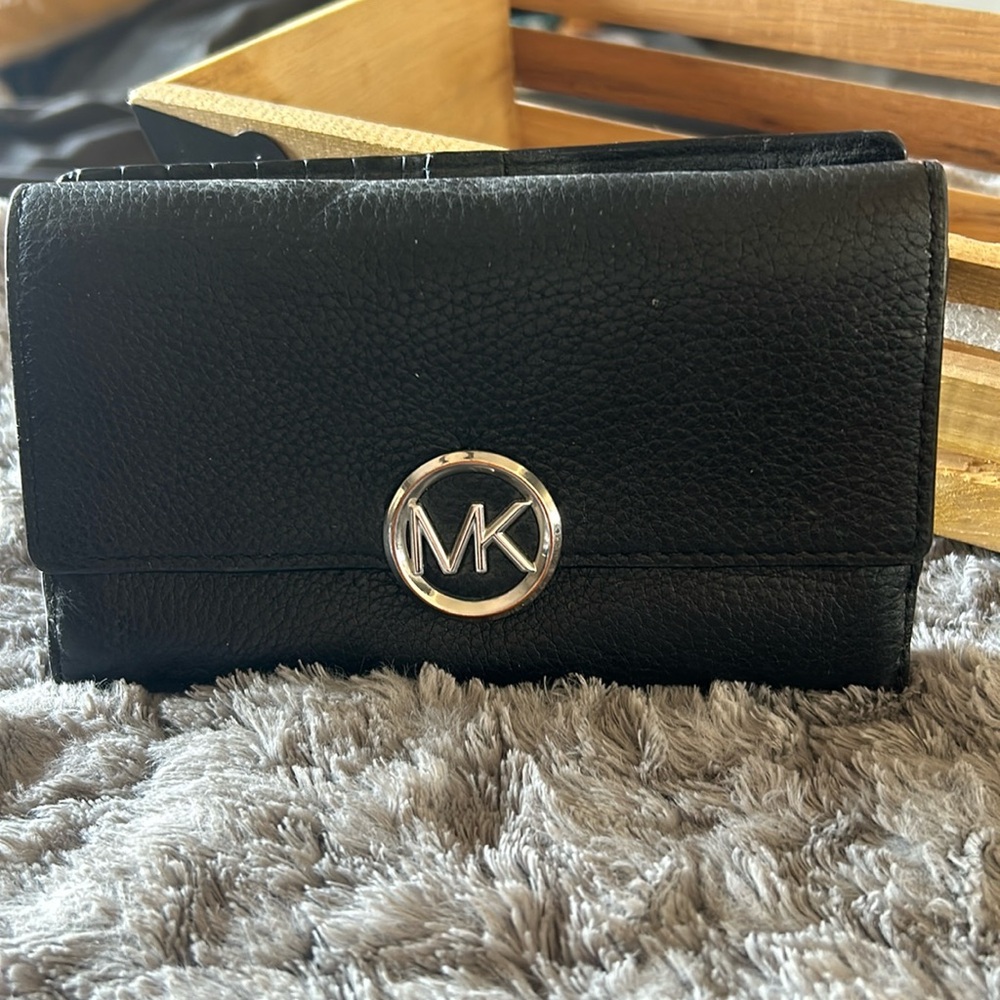 MK wallet with silver hardware.  Used but nice condition.